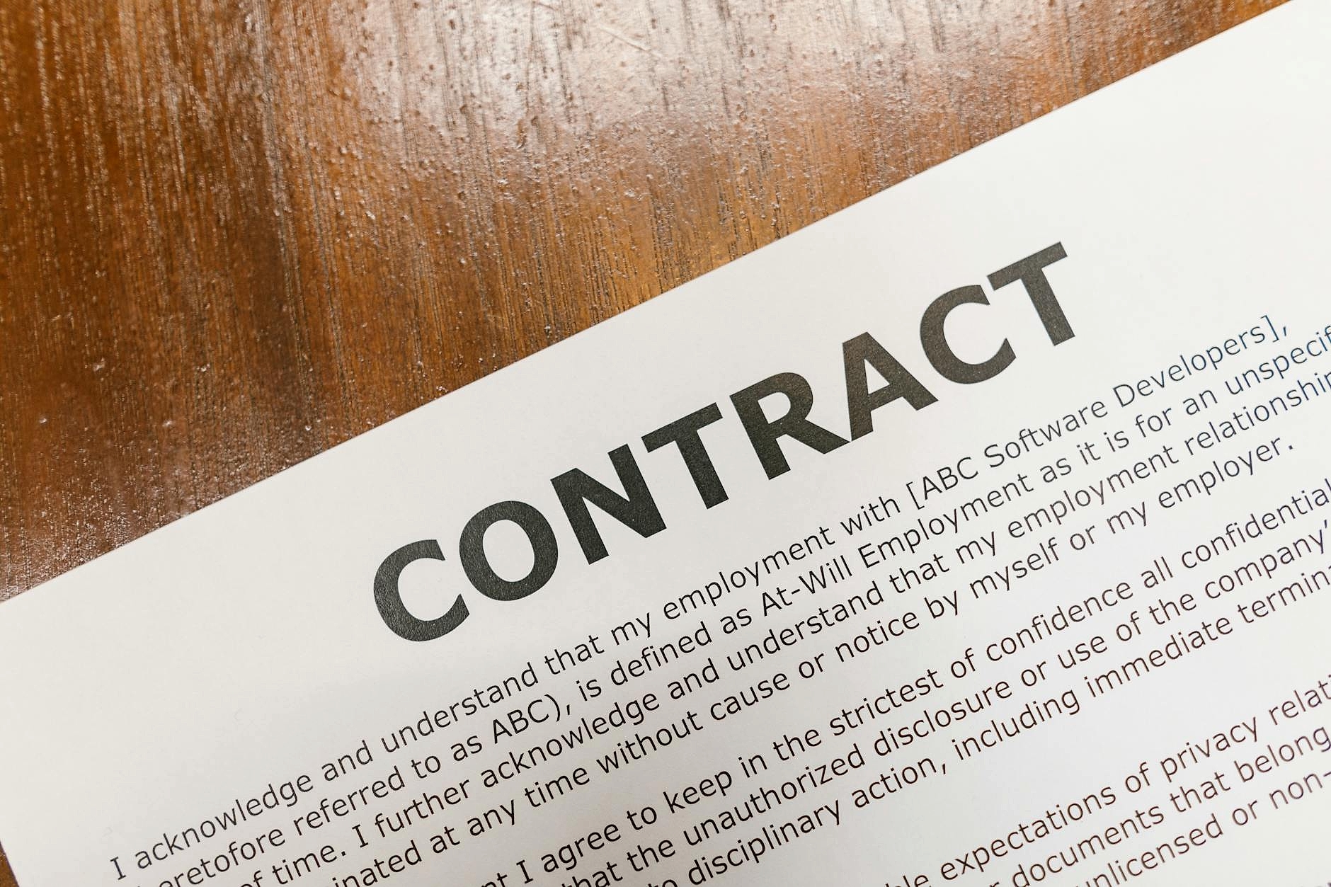 Vendor contract documents on desk for budget review